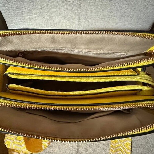 Yellow shoulder bag like new with strap and silver details