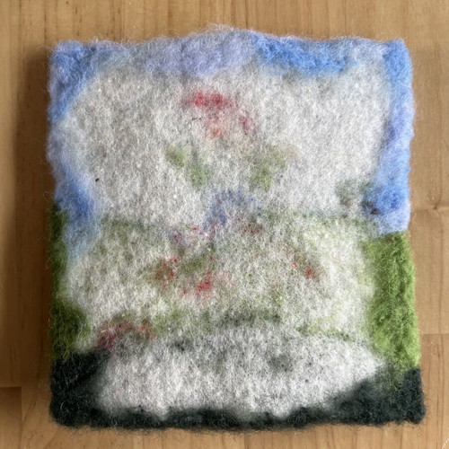 Handmade wool wall art with gnome on mushroom