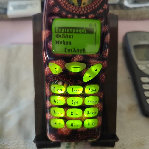 Nokia 3210 vintage cell phone used with new battery and front cover