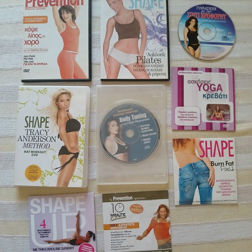 9 DVDs with fitness, pilates, wellness and yoga programs like new