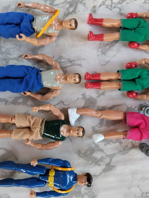 90's action figures used, one with broken leg