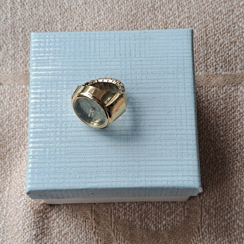 Ring watch quartz with khaki dial and gold bracelet like new