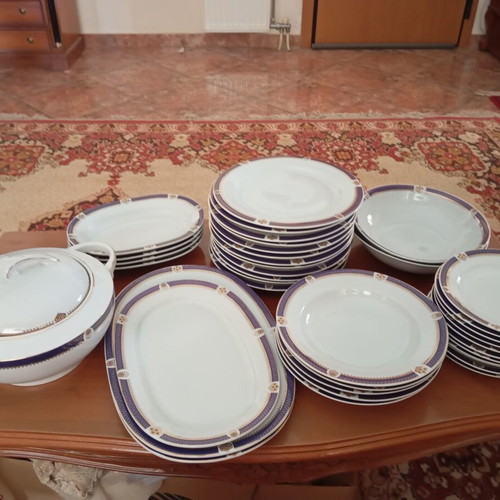 Dinnerware set like new with soup tureen, salad bowls, and plates