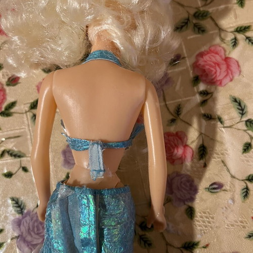 Mermaid doll with clothes used, damaged doll and worn clothes