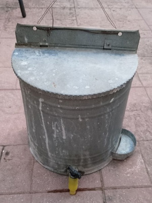 Vintage galvanized water storage with plastic tap used