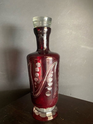 Red glass vintage wine bottle used