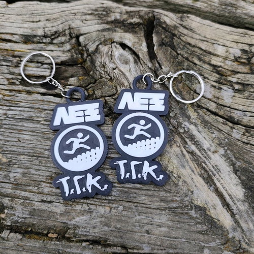 Set of 2 Lex T.G.K. keychains new with embossed design
