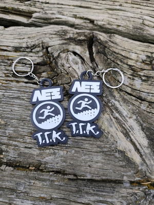 Set of 2 Lex T.G.K. keychains new with embossed design