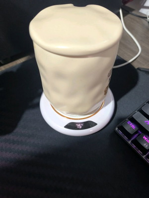 Heated cup coaster used, white with 3 temperature settings