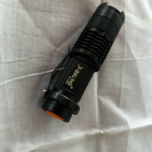 Small handheld flashlight like new, operates with AA battery