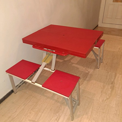 Folding camping table with 4 stools used