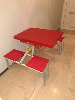 Folding camping table with 4 stools used