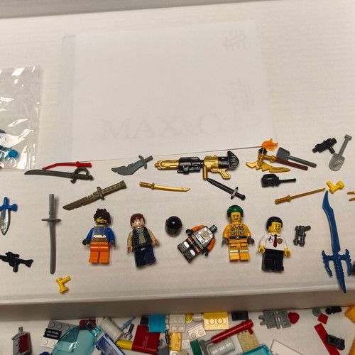 Lego lot like new with figures, weapons, and bricks