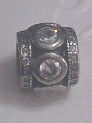 Charm decorated with zircon stones, like new, silver 925
