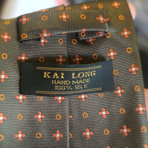 Silk ties new in dark green, orange, and copper colors
