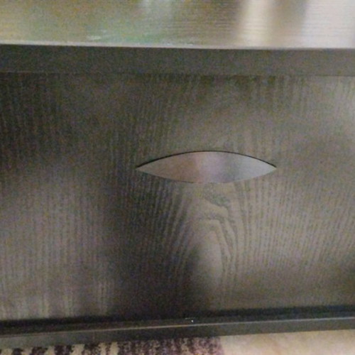 Side table used with storage and wheels, black wood effect
