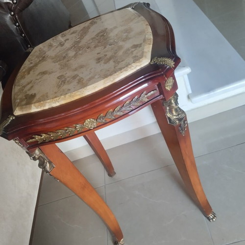 Antique table with marble top and bronze caryatids