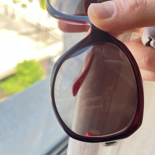 Christian Dior sunglasses used, black and red frame, lens scratched