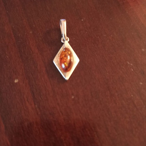Silver pendant with amber new