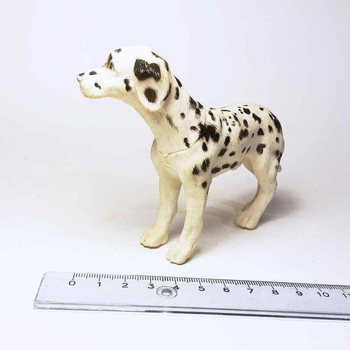 Plastic dog figure used with marks and scratches