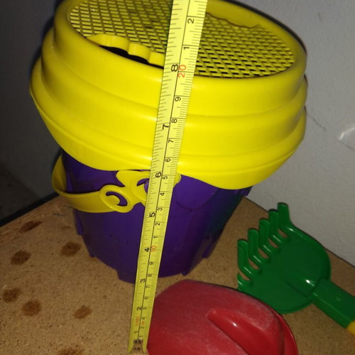 Sand bucket used with shovel, rake and 4 toy cars