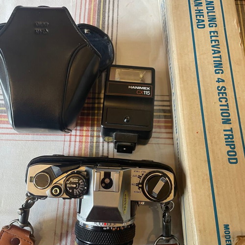 Olympus camera with tripod, flash and lens unused