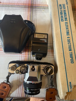 Olympus camera with tripod, flash and lens unused