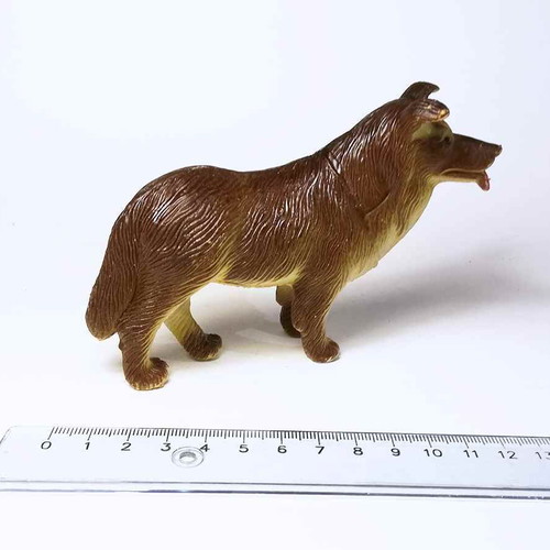 Dog plastic figure used with scratches and marks