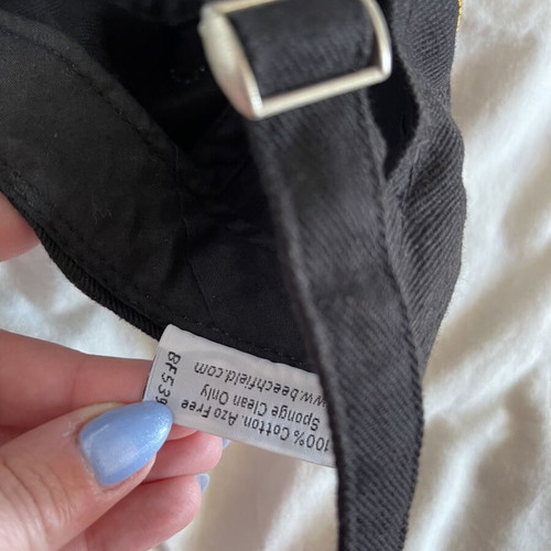 Magners cider branded hat used with small discoloration