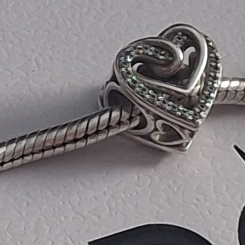 Pandora charm heart with linked hearts decorated with zircon stones, like new