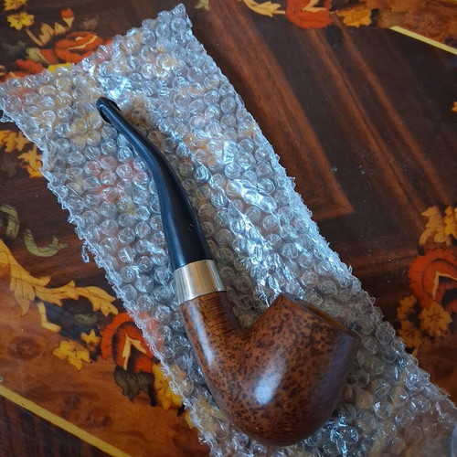 Vintage briar tobacco pipe with metal ring