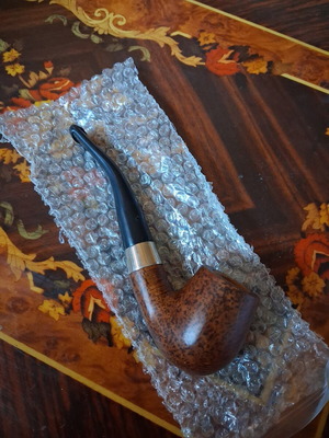 Vintage briar tobacco pipe with metal ring