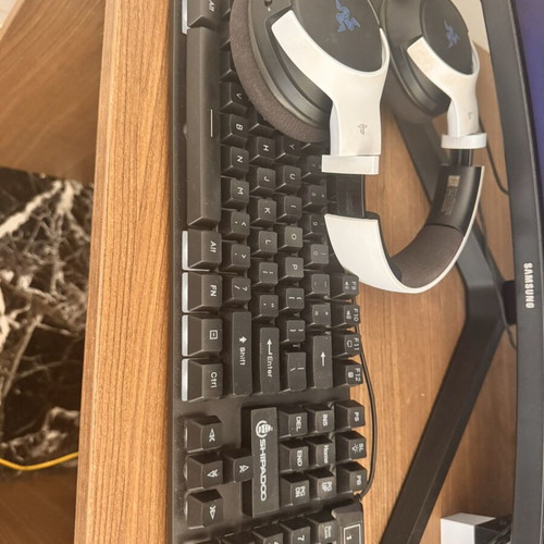 Gaming computer with Samsung Odyssey 30 inch monitor, Razer Kaira headset, Logitech controller