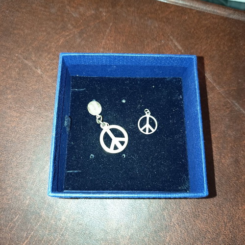 Peace symbol silver pendants set like new, two pieces
