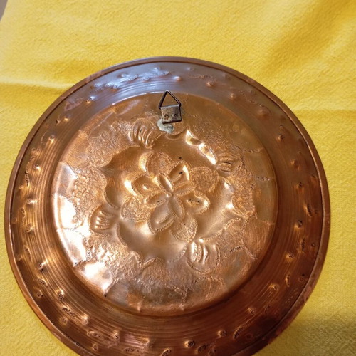 Vintage carved copper wall plate like new with embossed floral design