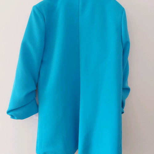 Blue jacket new with unique sleeve and tags
