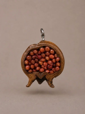 Handmade pomegranate pendant from natural material, like new
