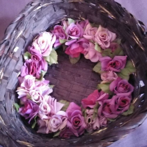 Decorative basket used with candle and floral wreath