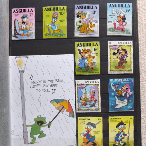 Disney collectible album with 220 stamps and 16 cards