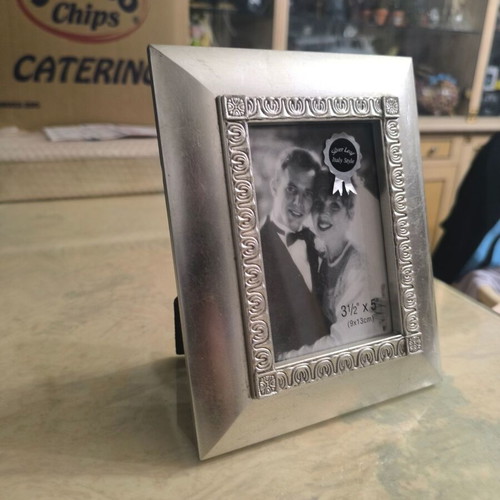 Silver photo frame like new with elegant decorative border