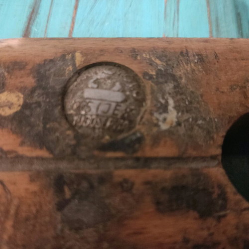 Wooden plane used with signs of wear, about 25 centimeters