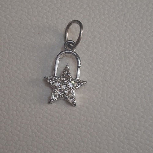 Charm star decorated with sparkling stones used, silver