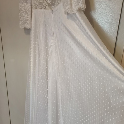 Romantic vintage-inspired wedding dress with polka dot tulle and lace