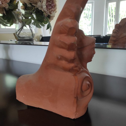 Traditional clay acroterion (anthemion) depicting the form of the God Hermes
