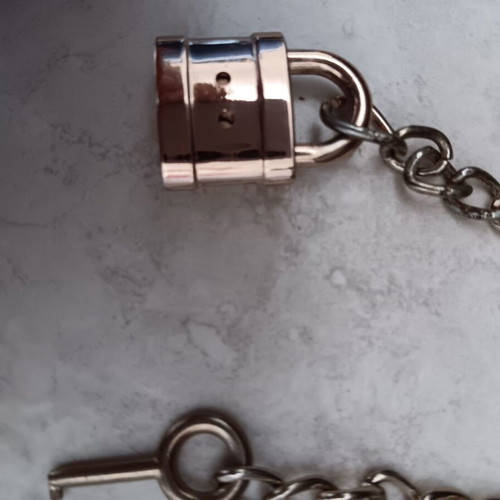 Small padlock with key used, in good condition