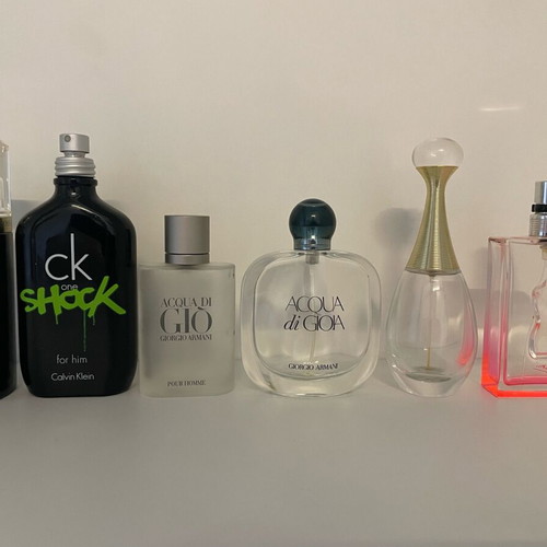 Collection of 44 empty genuine perfume bottles, various brands