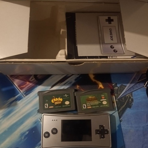 Game Boy Micro like new with 3 games, original packaging and charger