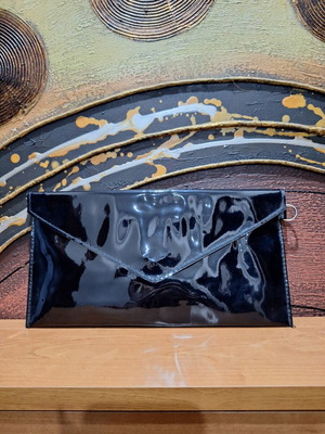Women's shoulder bag black used with missing strap and lipstick stains