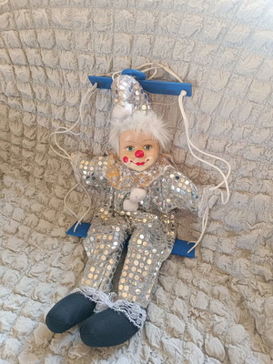 Vintage porcelain clown on swing like new, decorative