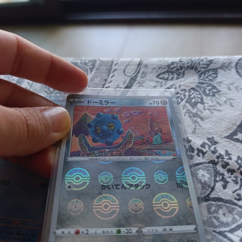 Japanese Pokemon TCG cards with 5 card stands